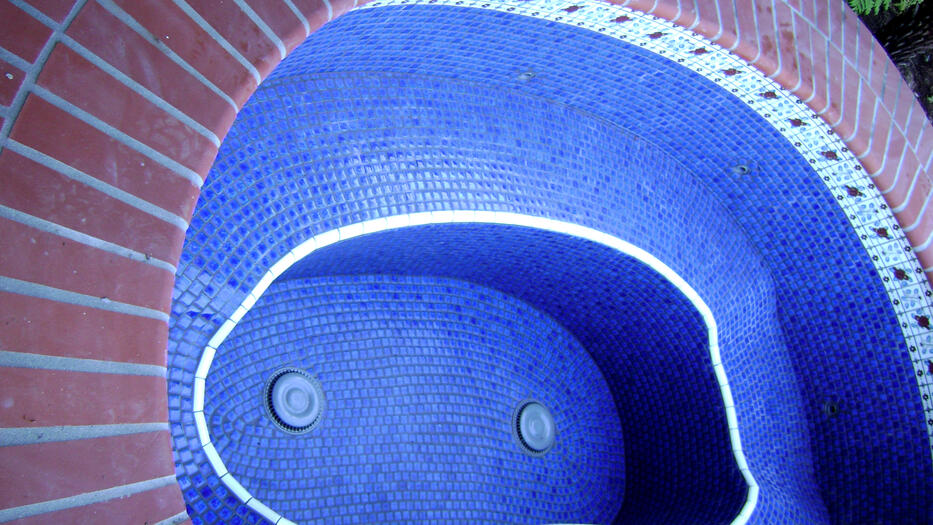 Spanish style all tile spa with white accents Spanish style all tile spa with white accents